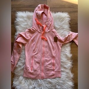 Size 8 bright pink lululemon zip up jacket with coral orange piping and detail